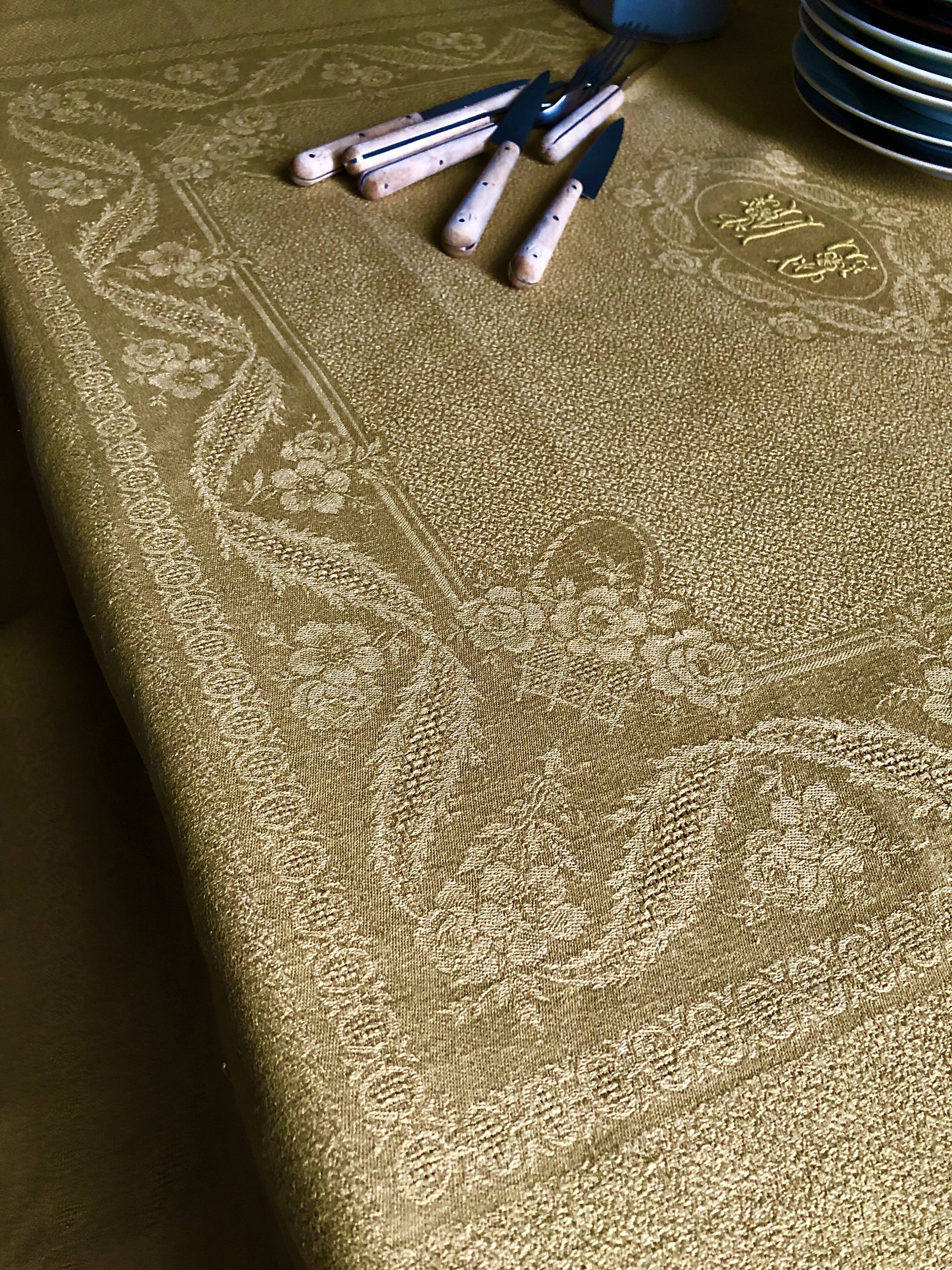 Old linen tablecloth and evening tinted in vermeil