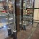 Early 20th-century shop display cabinet in oak with sliding doors.