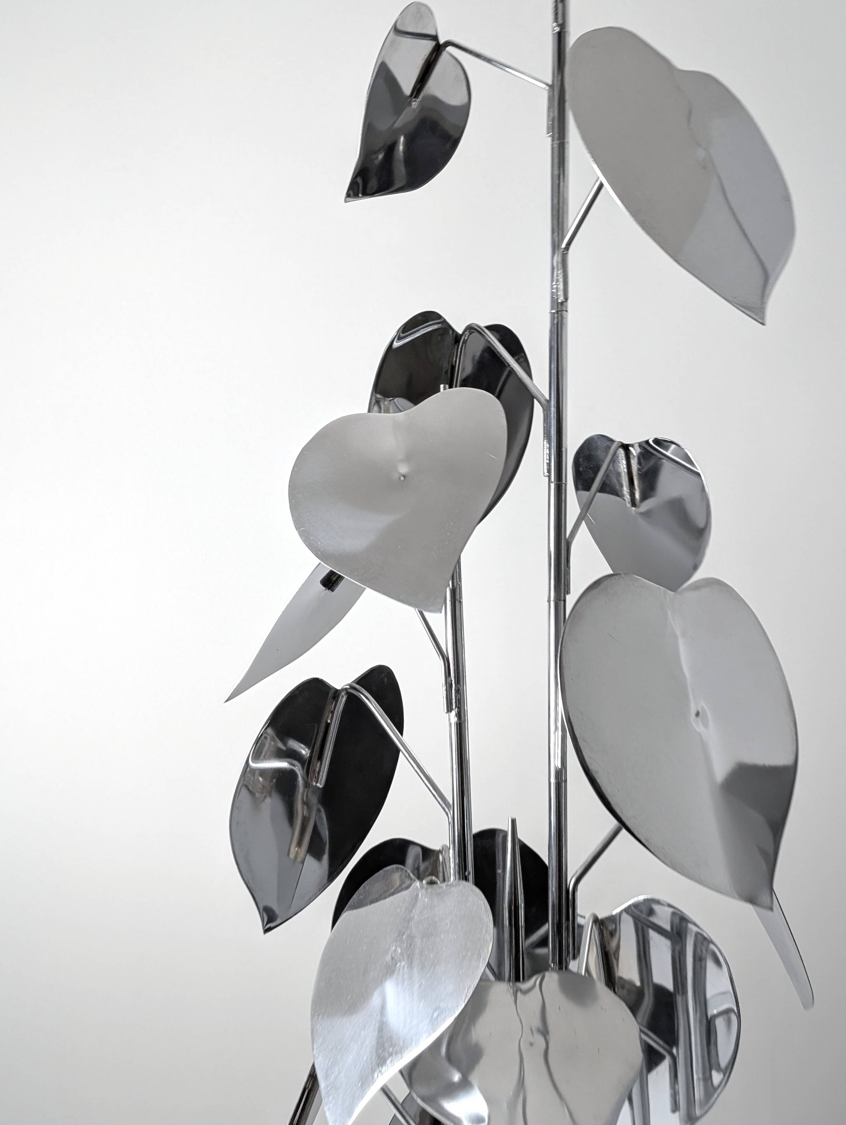 Standing sculpture with chrome leaves and circular base, 1970s