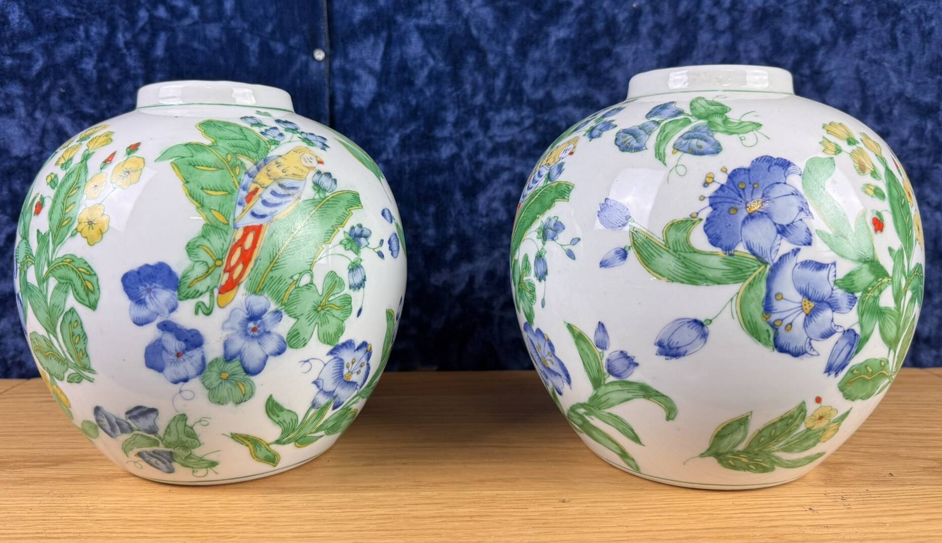China circa 1900: pair of porcelain ball vases with birds and flowers