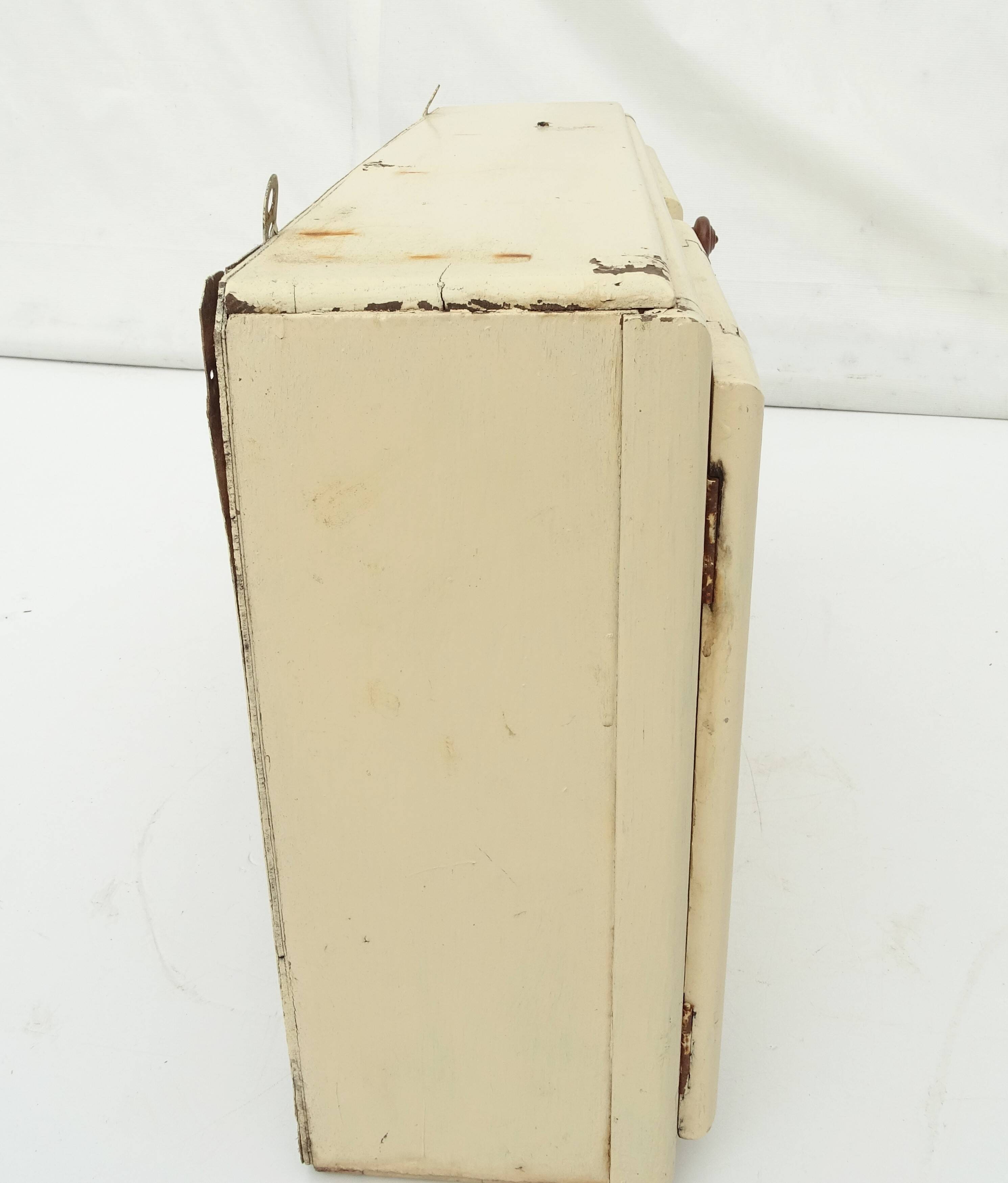 Small vintage wooden wall cupboard.