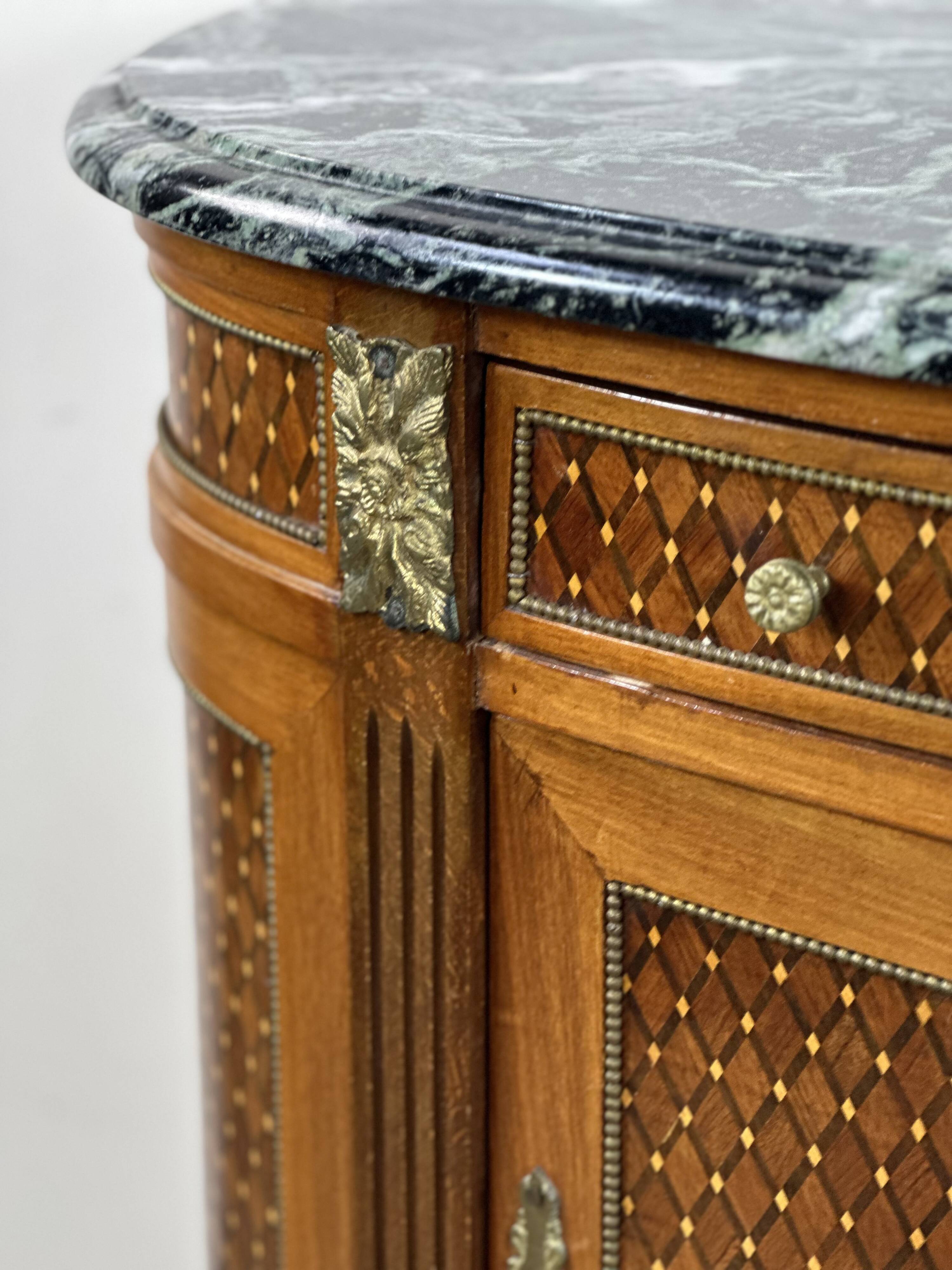 Half-moon commode in the Louis XVI style