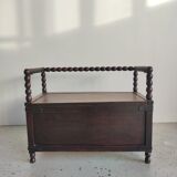 Natural wood chest forming a bench, ringed shoulders