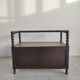 Natural wood chest forming a bench, ringed shoulders