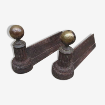 Pair of old cast iron chenets and brass ball