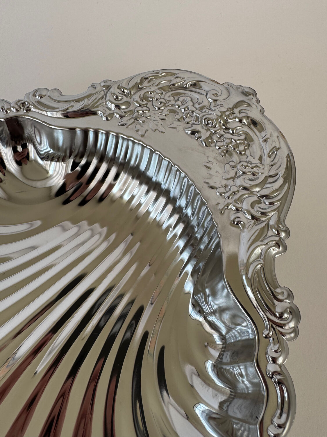 Large silver-plated serving dish in the shape of a vintage shell.