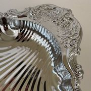 Large silver-plated serving dish in the shape of a vintage shell.
