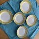 6 small plates with yellow borders and floral pattern gold antiques