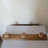 Old wall coat rack in raw wood