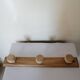Old wall coat rack in raw wood