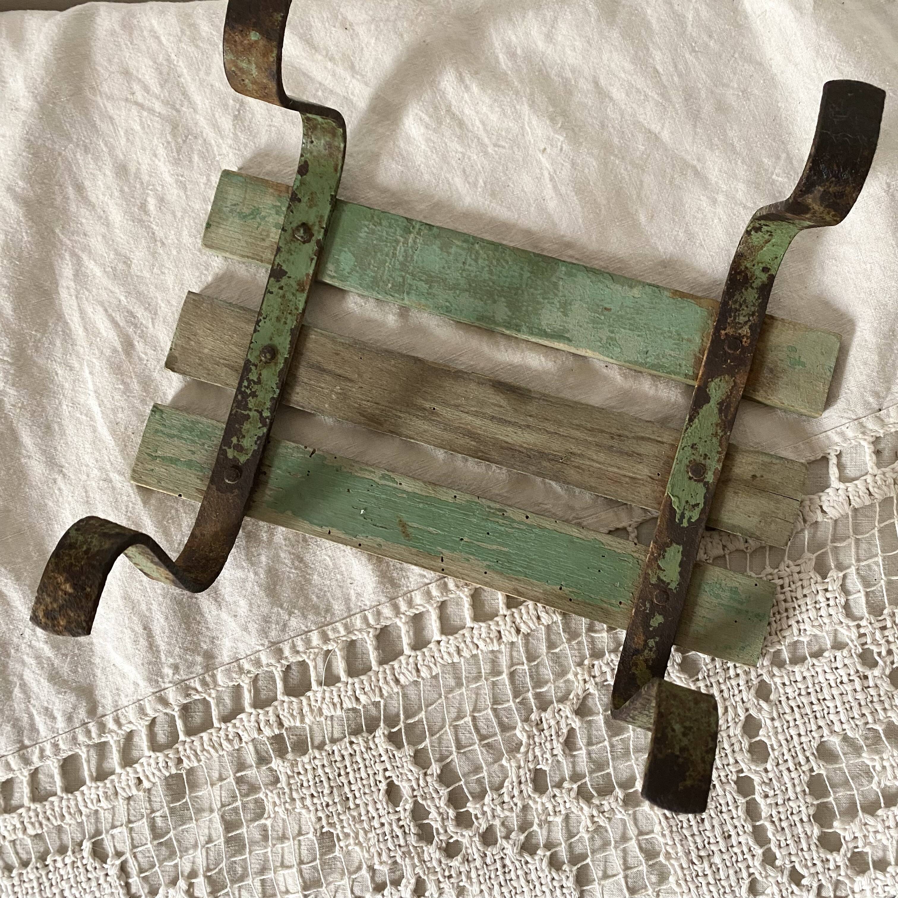 Low stool with wooden and metal slats