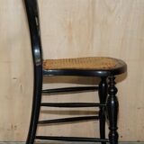 Four antique Regency bergère chairs with mother-of-pearl inlay.