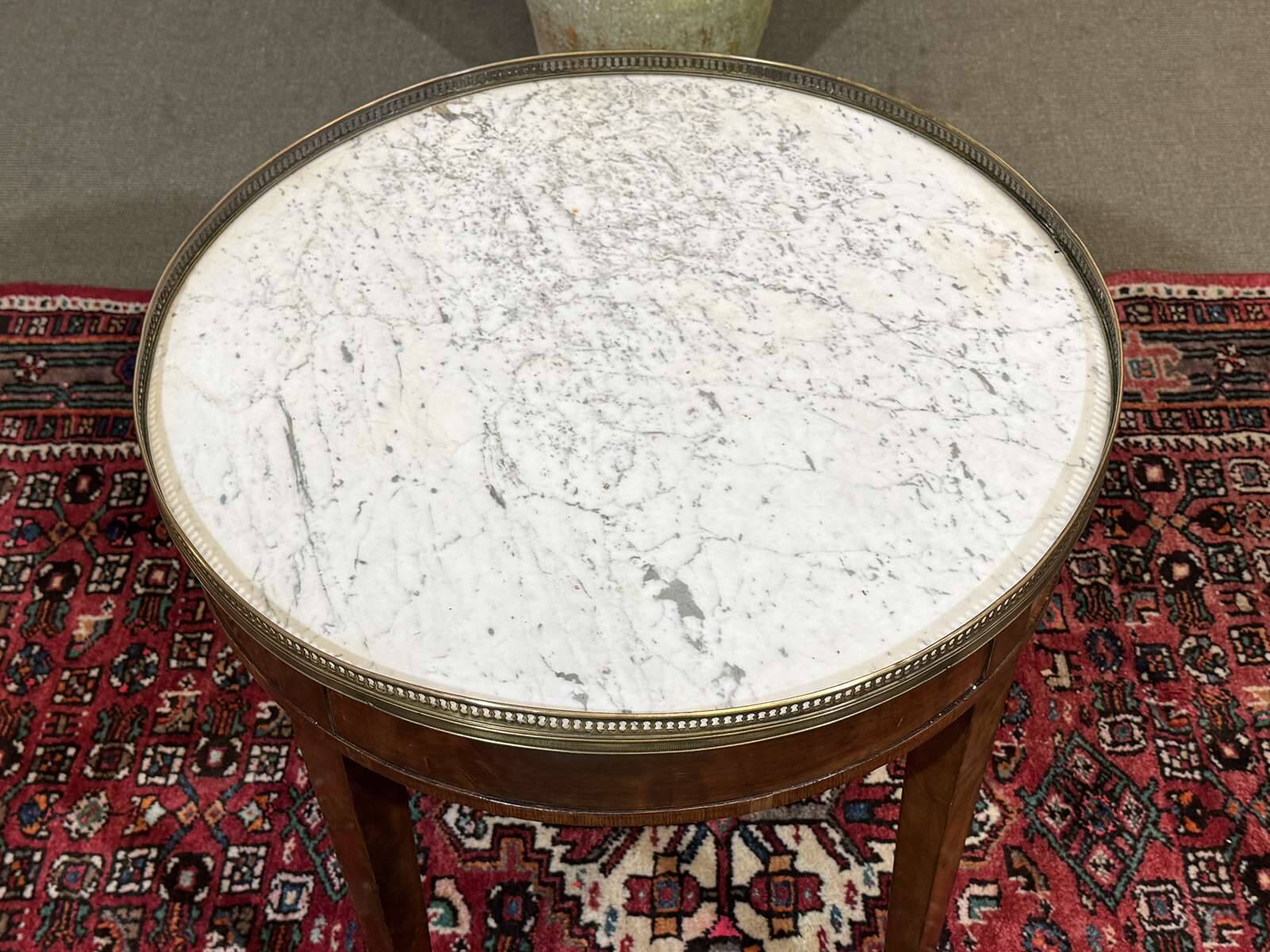 Louis XVI style bouillotte table in mahogany with a white marble top.