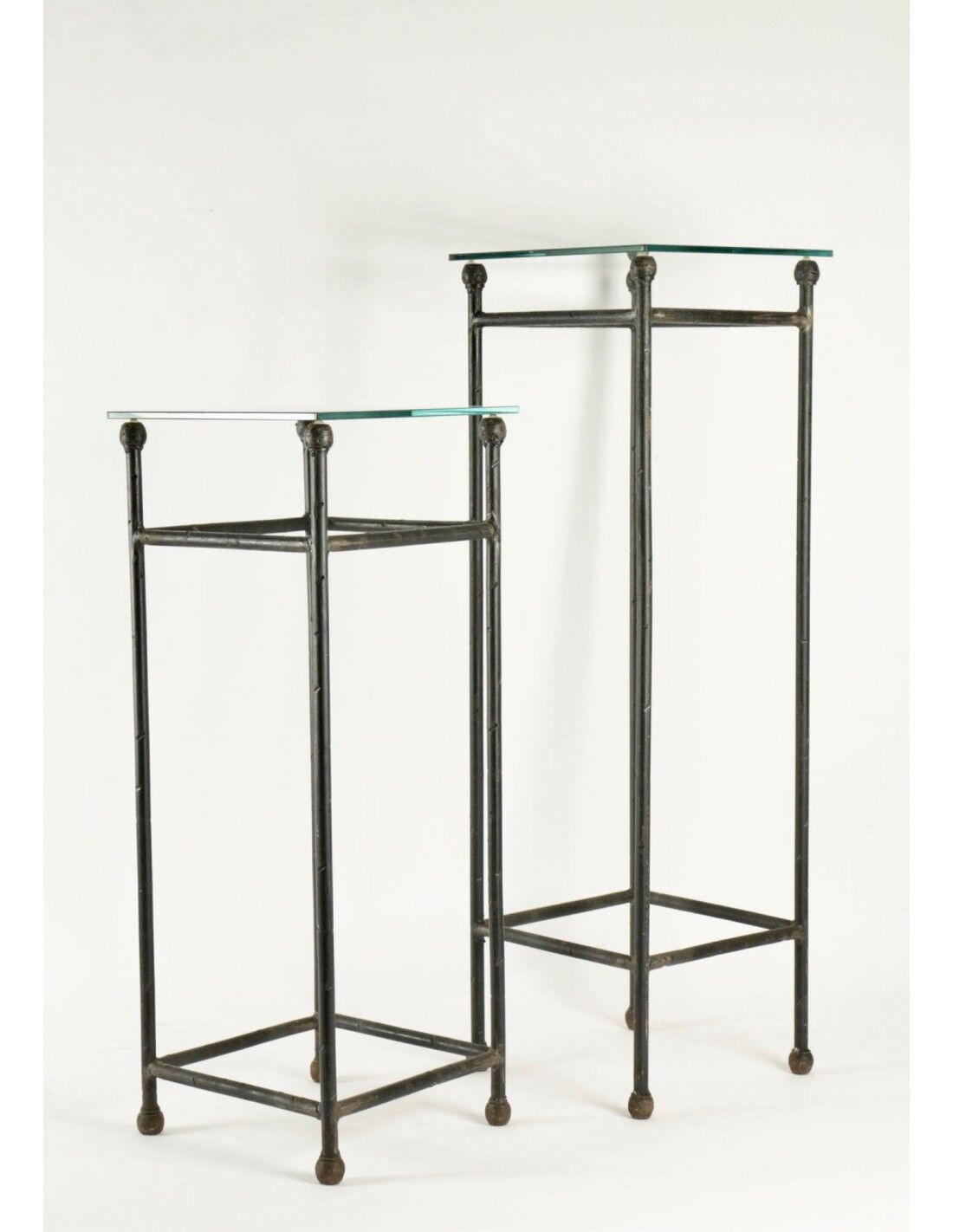 Two consoles, wrought iron sheaths on glass top, twentieth century