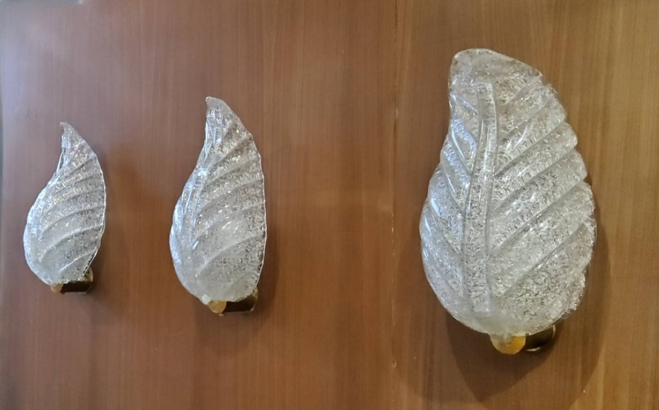 Murano, leaf sconces in worked transparent glass, 1940s