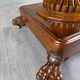 Oval Empire-style table with a central pedestal, 19th century.