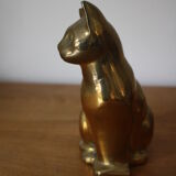 Cat sitting in brass