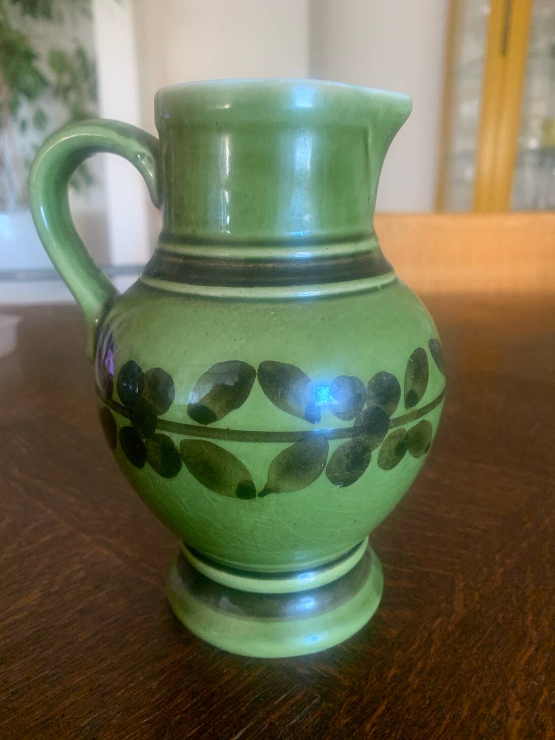 Green ceramic jug
