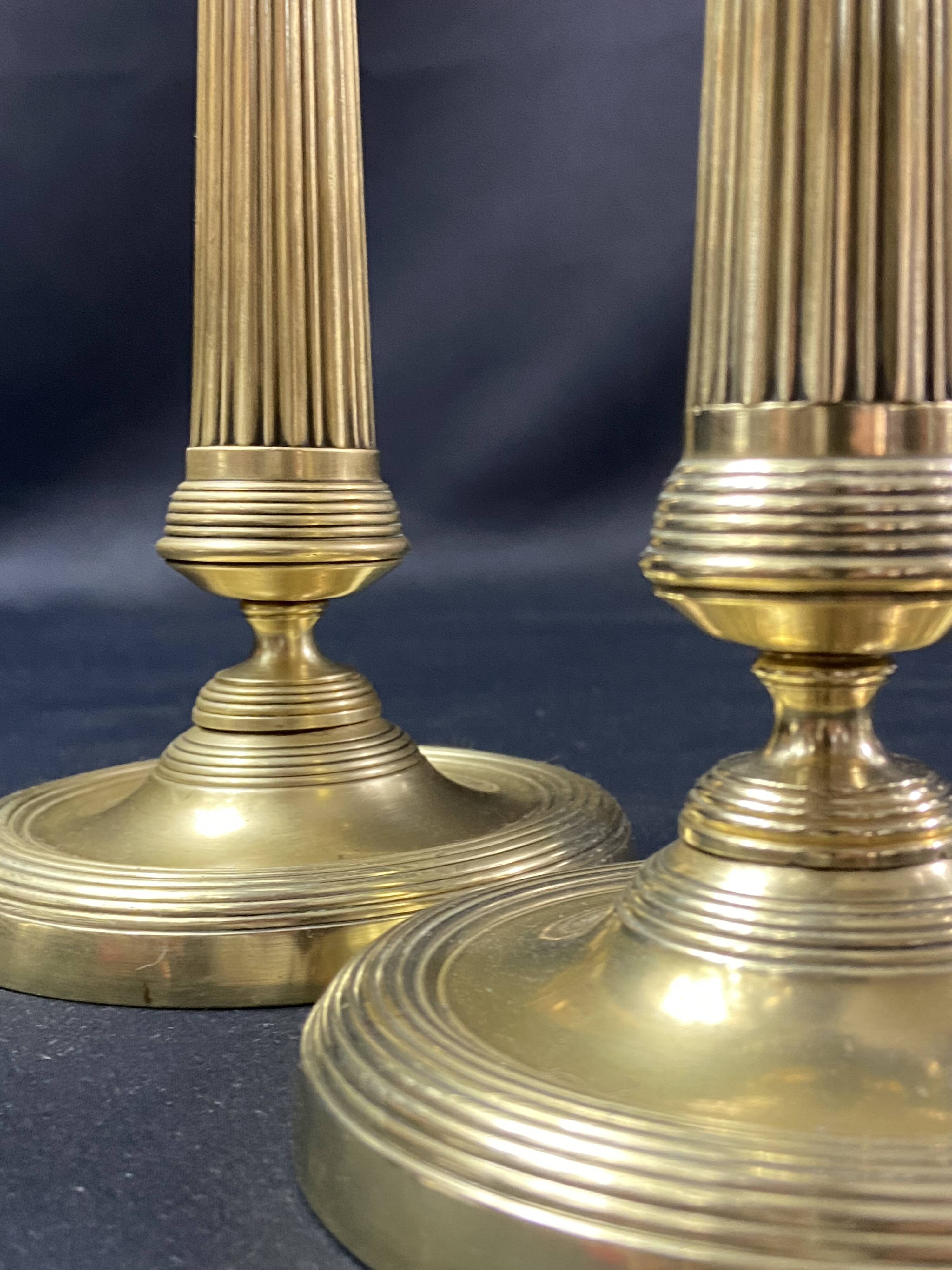 Pair of 19th century gilt bronze candlesticks with fluted shafts, Restoration