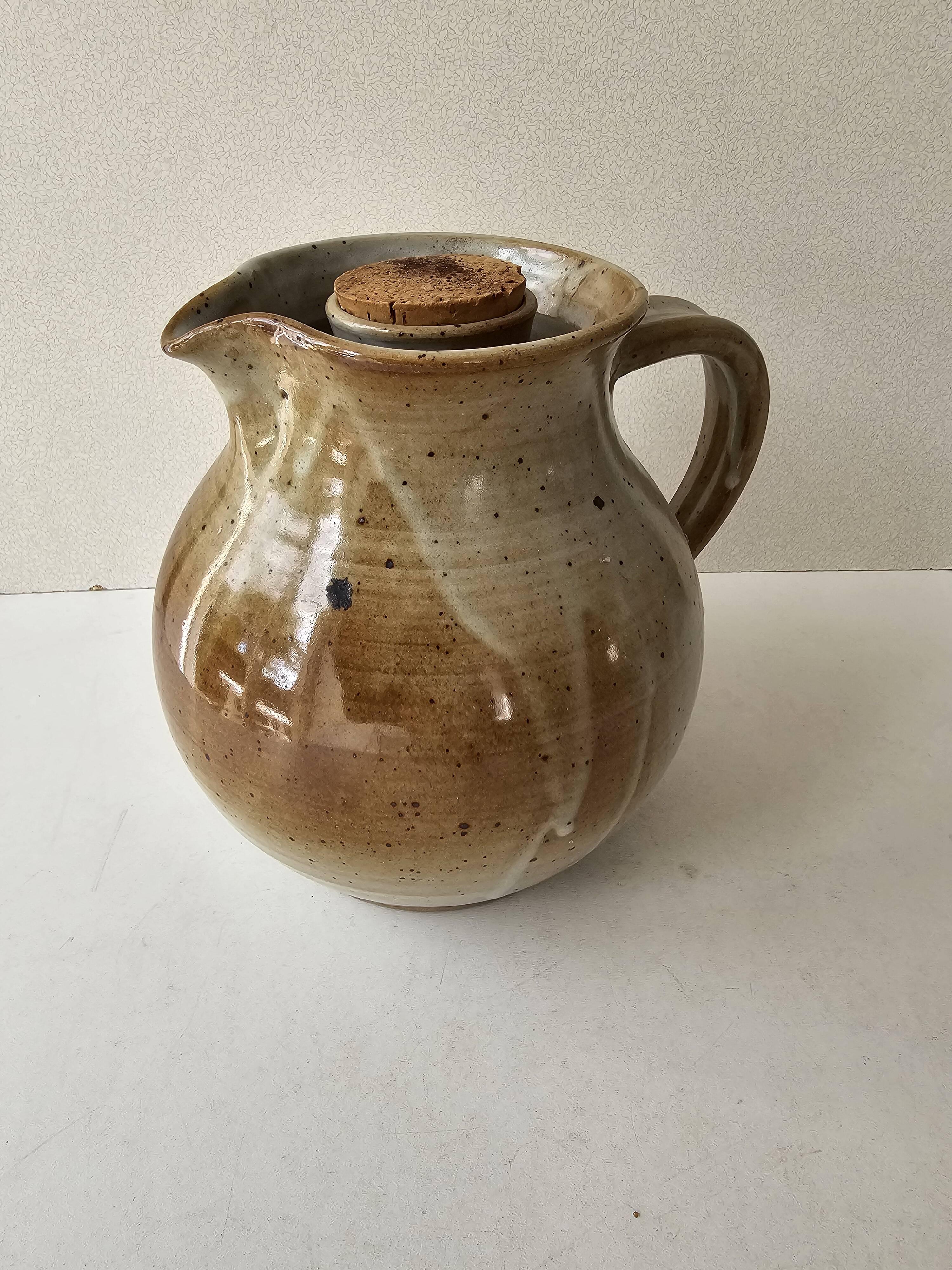 Signed, poured ceramic wine pitcher (signature to be identified)