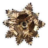 Vintage floral metal applique in gold.