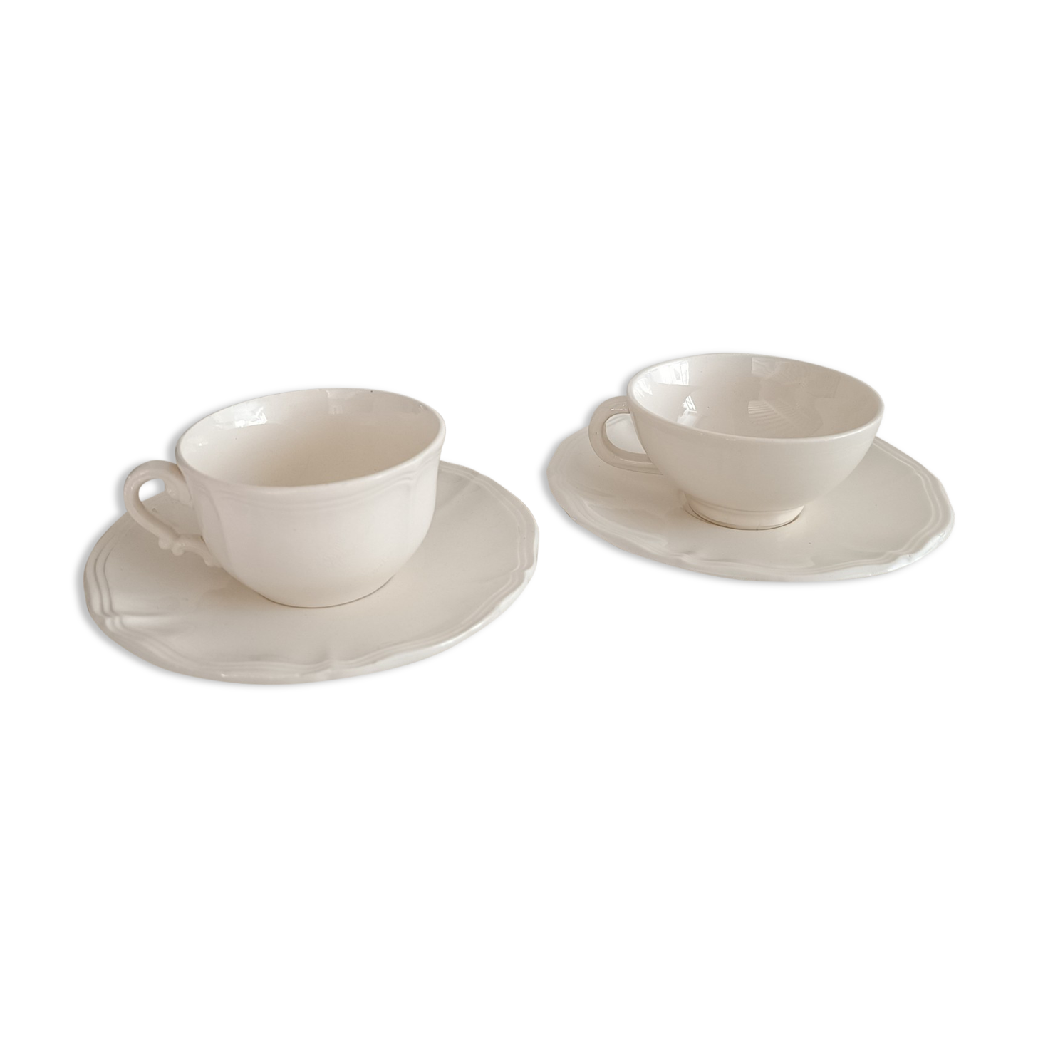 Two ivory cups and saucers from Sarreguemines