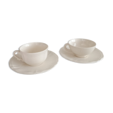 Two ivory cups and saucers from Sarreguemines