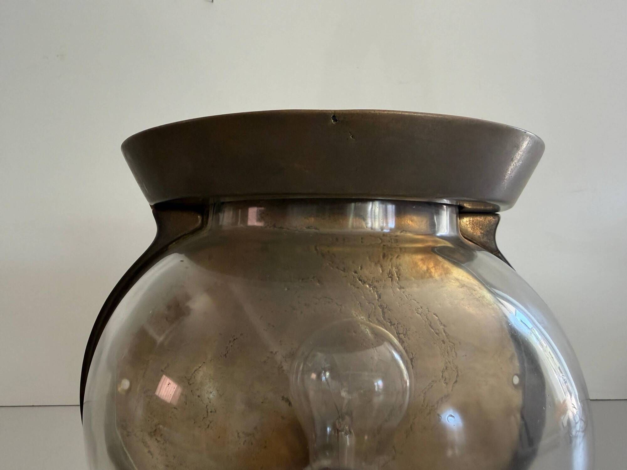 Pair of bronze and glass wall lights from the mid-century, 1960, Italy.