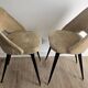 Pair of vintage barrel chairs in boucle fabric with brass splayed legs.