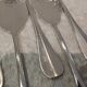6 individual silver-plated metal sauce spoons with hammered baguette handles