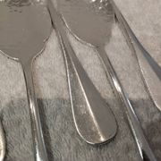 6 individual silver-plated metal sauce spoons with hammered baguette handles