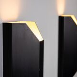 Architectural pair of vintage black metal wall lamps with angular geometric