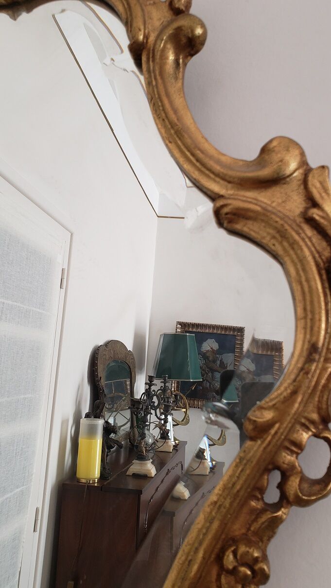 Beveled mirror and gilded wood