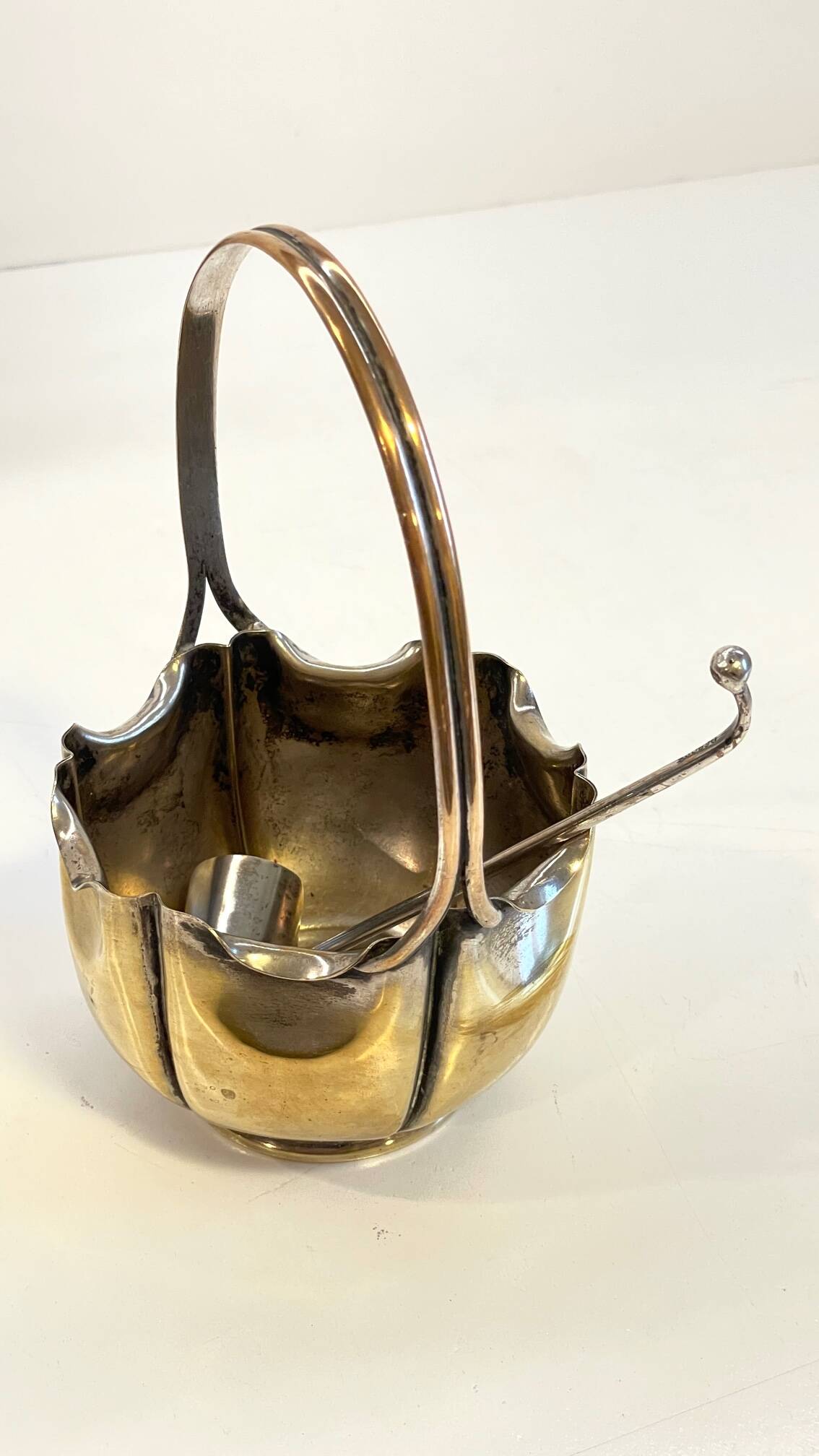 silver metal sugar bowl with gold patina