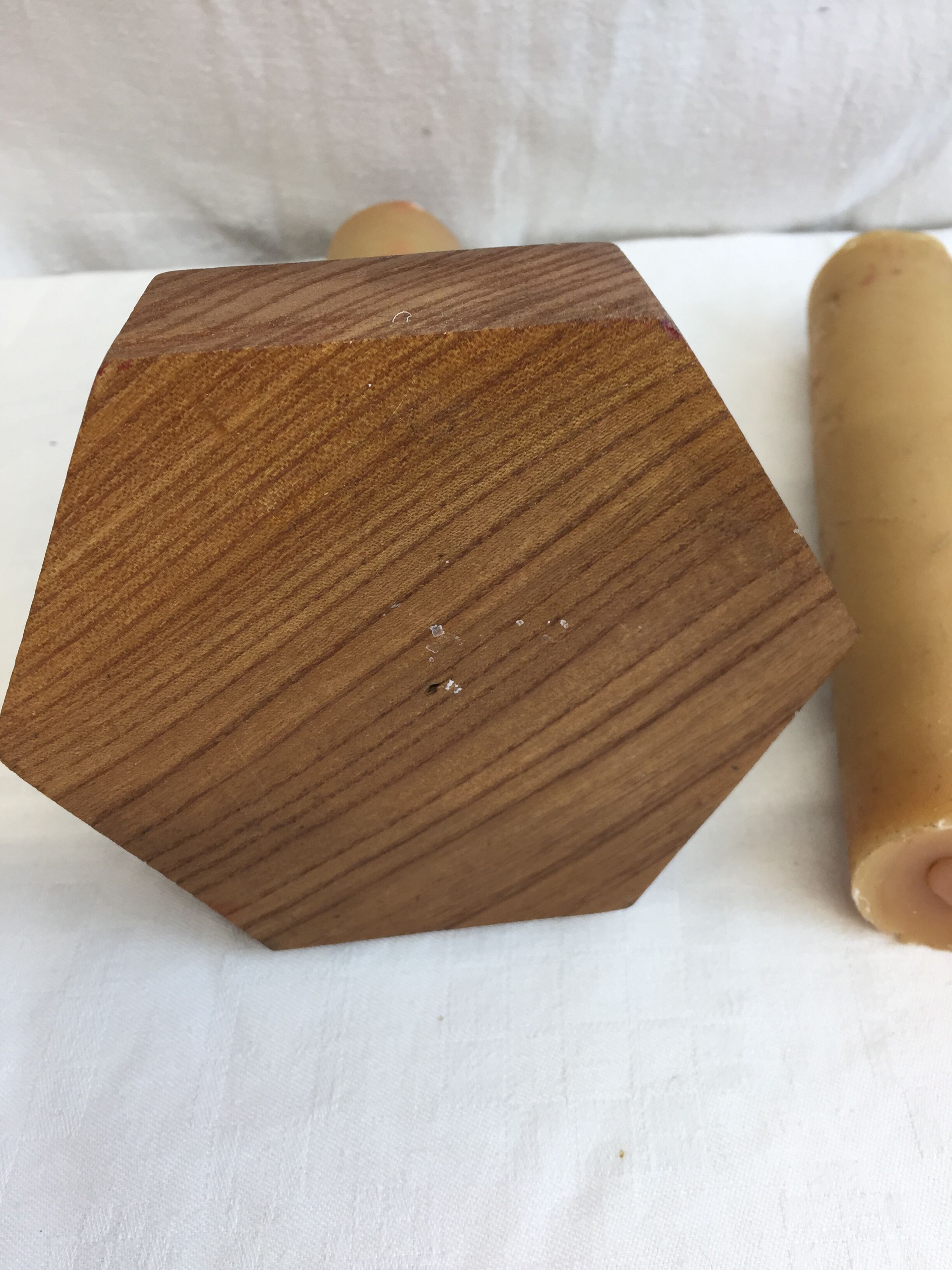 Handmade natural wood candle holder, hexagonal shape and its 3 old beeswax candles.