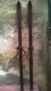 Pair of old skis with its poles