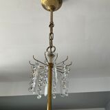 Old brass chandelier and crystal grapevines
