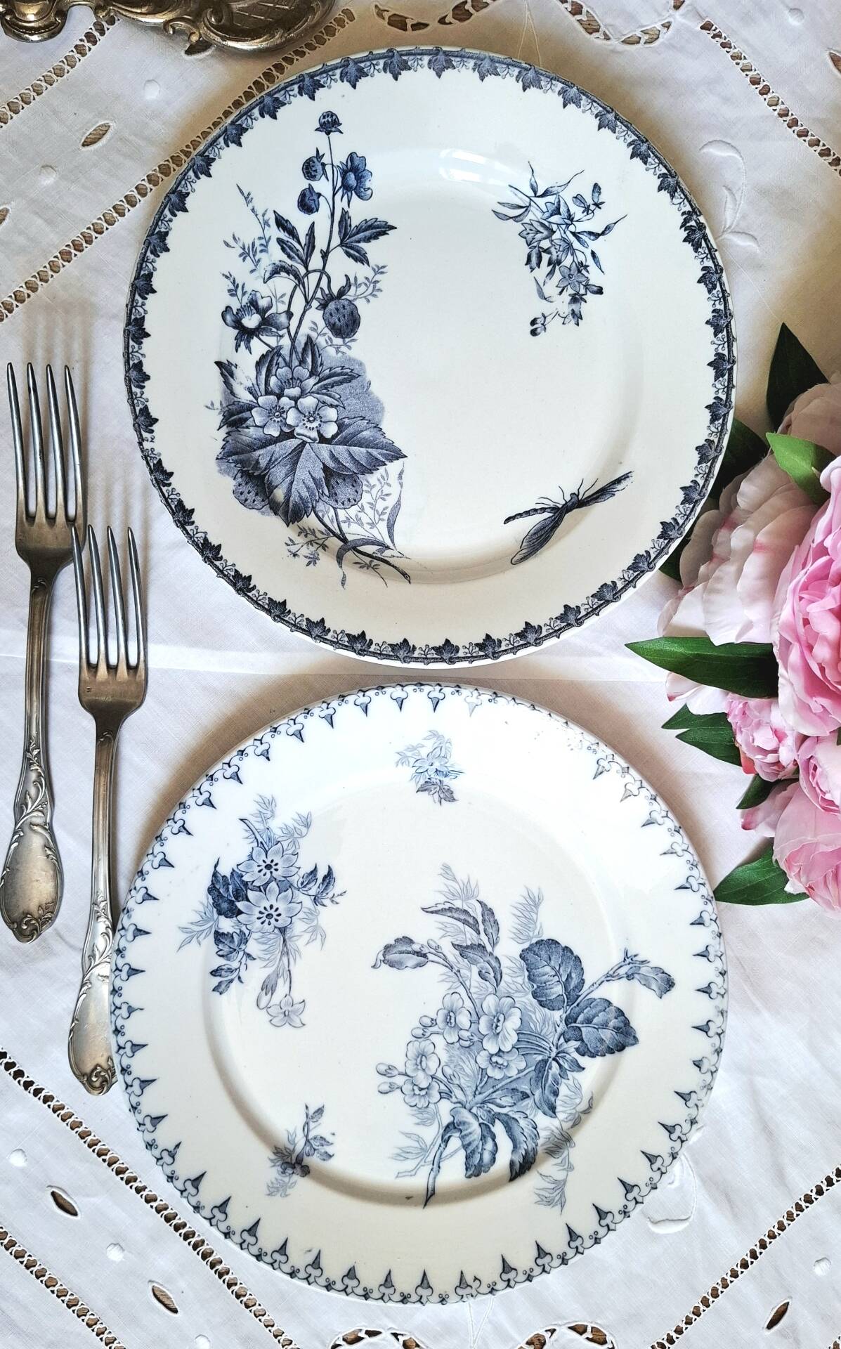 Old mismatched flat plates made of ironstone earthenware.