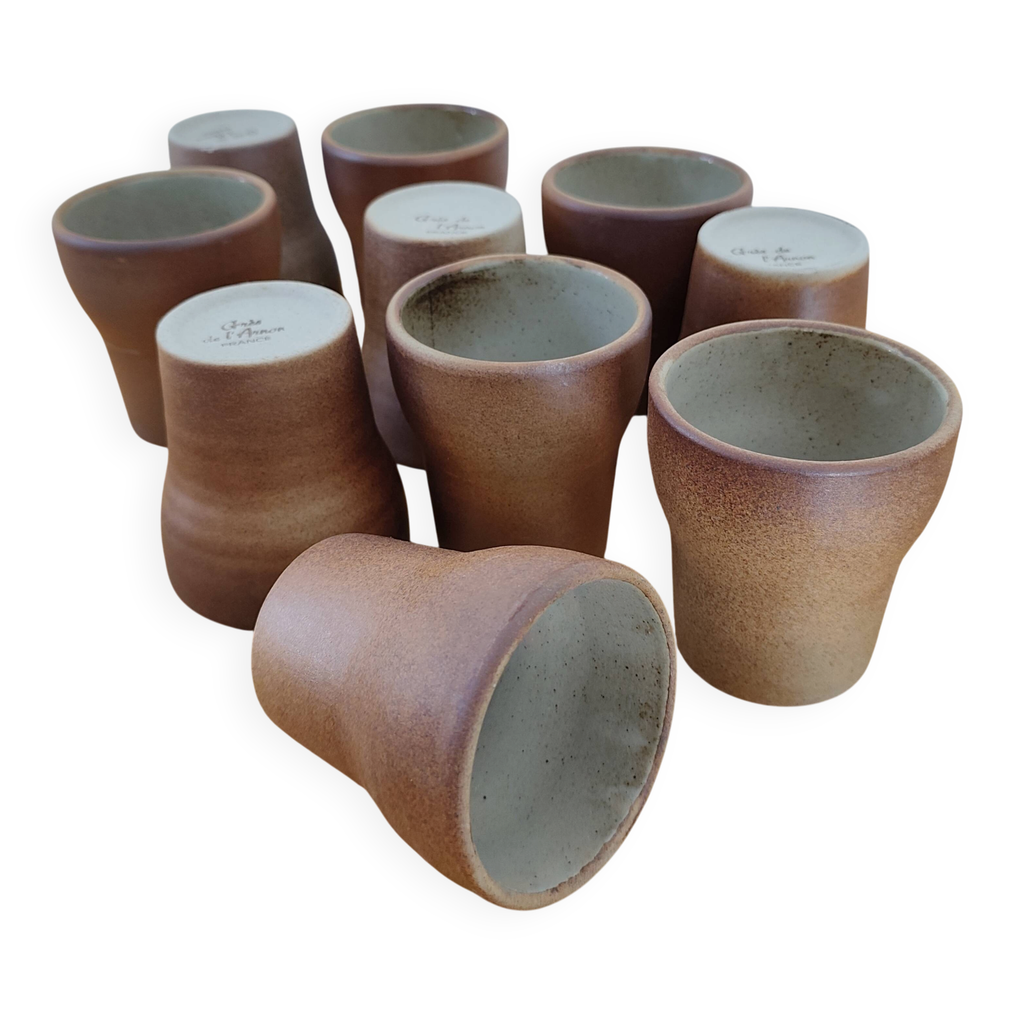 Stoneware cups – Armor stoneware set of 10 and an 11th French stoneware cup.