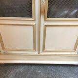 Bookcase 2 painted in ochre and cream mesh doors beginning 20 th