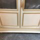 Bookcase 2 painted in ochre and cream mesh doors beginning 20 th