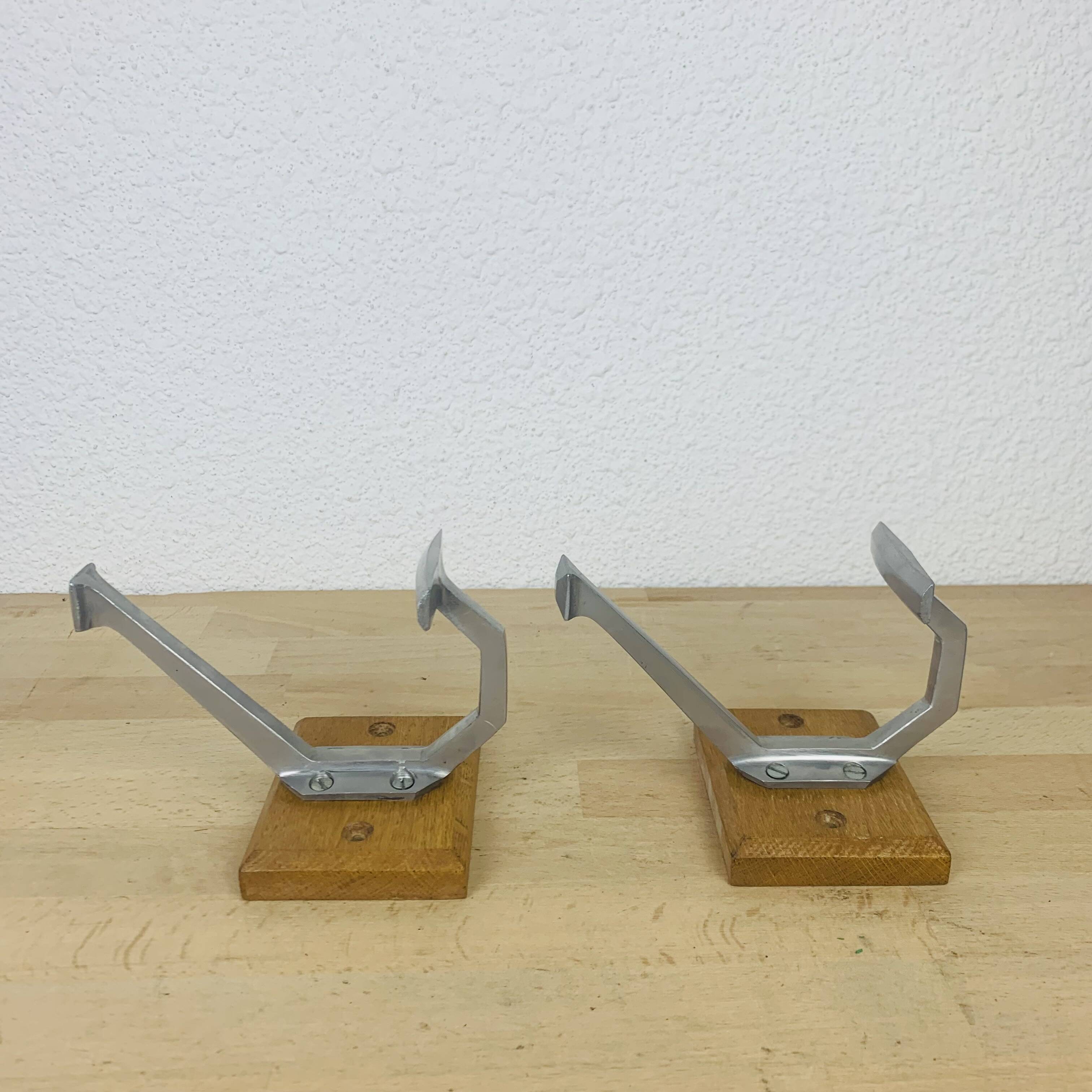 Pair of vintage aluminum coat hooks