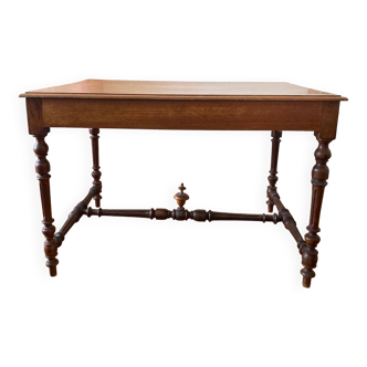 Table with a spacer topped with a spinning top.