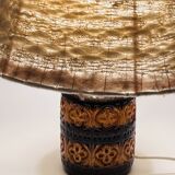 Vintage ceramic lamp with relief and wool shade.