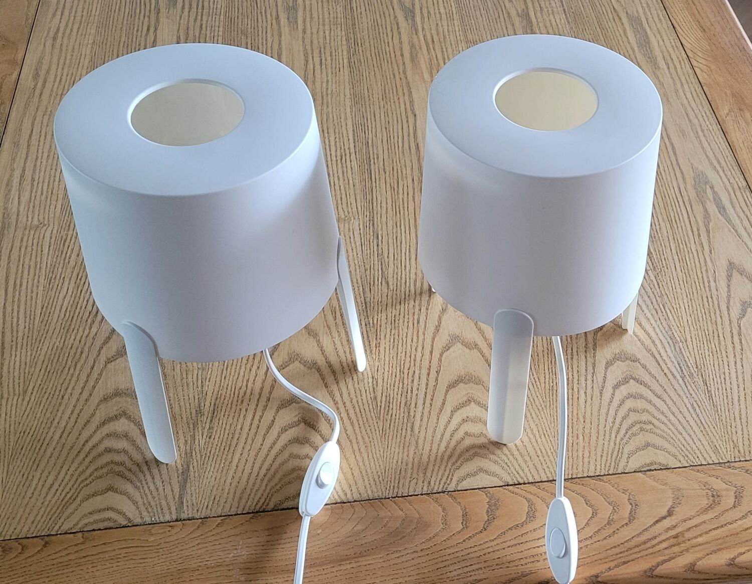 Pair of white Ikea Tvärs bedside lamps