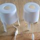 Pair of white Ikea Tvärs bedside lamps