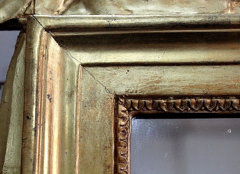 Miroir en bois doré, style Louis XVl, début XXe