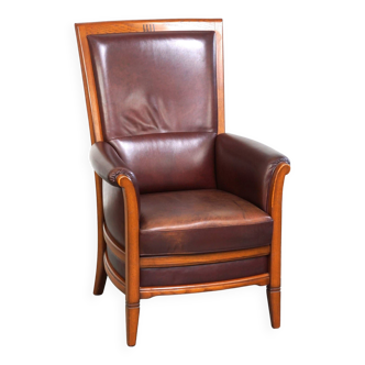 Very comfortable classic leather armchair with high back in a mild Art Deco style