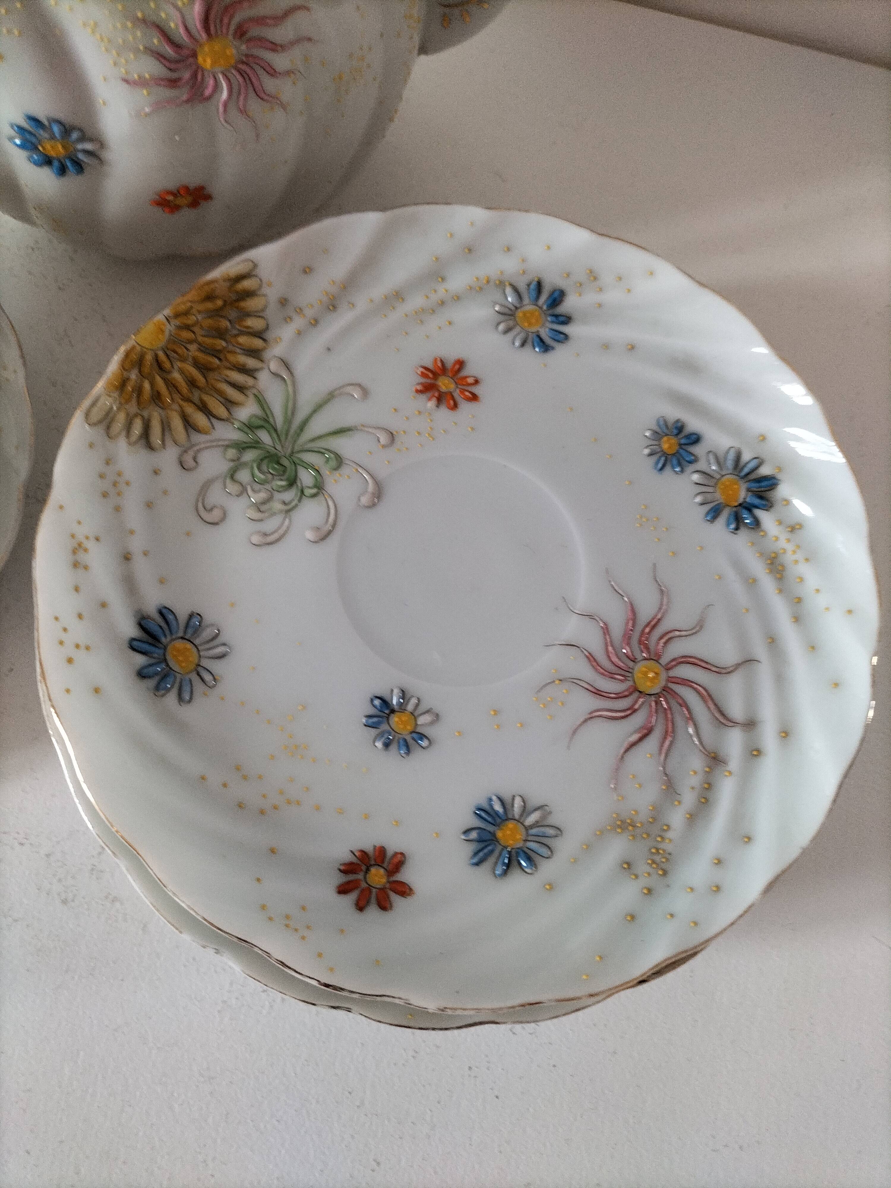 coffee pot, cup and saucers