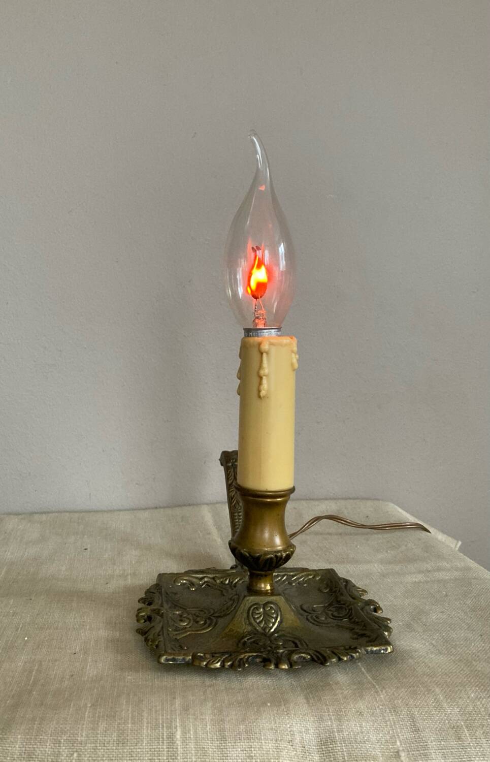 Candle holder with 20th century spelter socket mounted as a flame bulb lamp